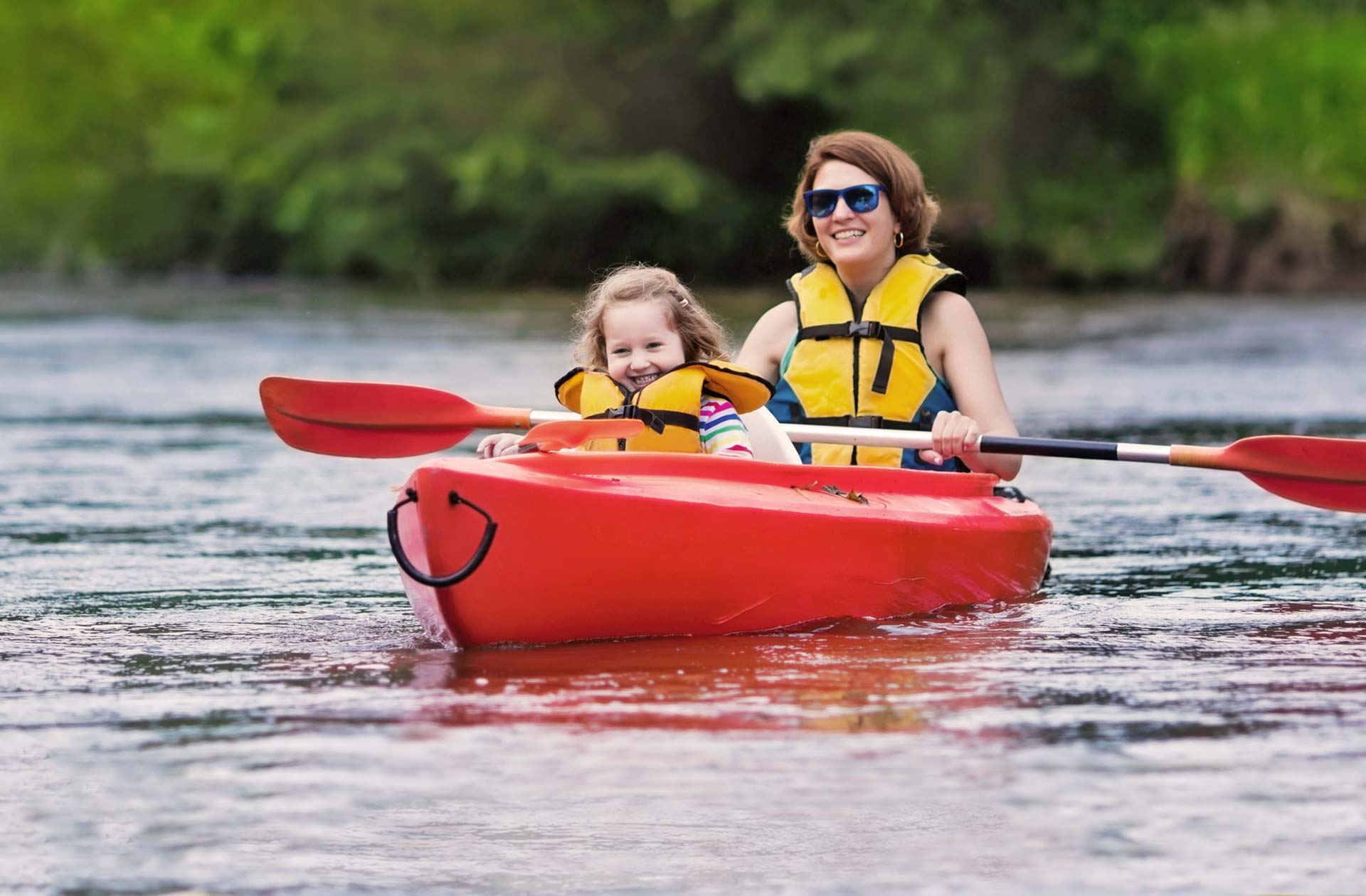 Mother and Daughter Kayaking on Puhoi River